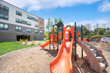 the playground at the flats at big tex apartments